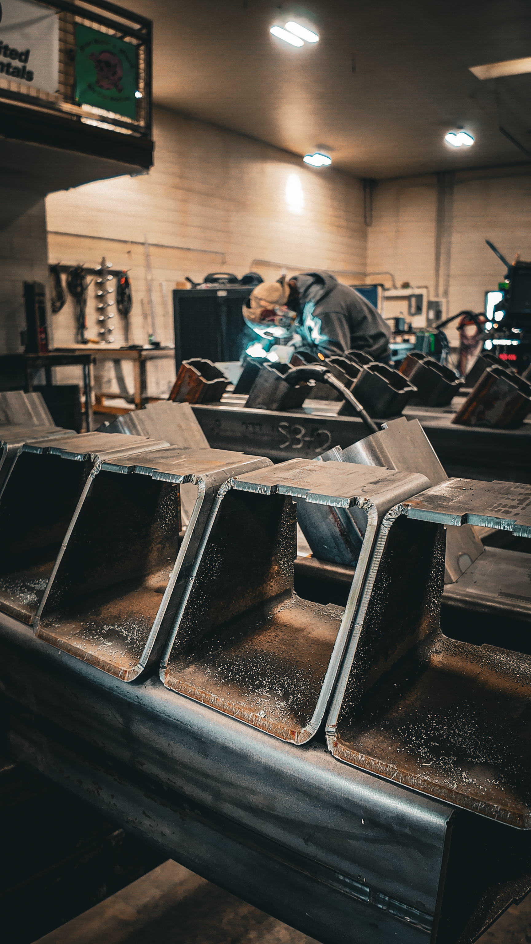 Steel fabrication shop floor showing in-house welding and fabrication operations.