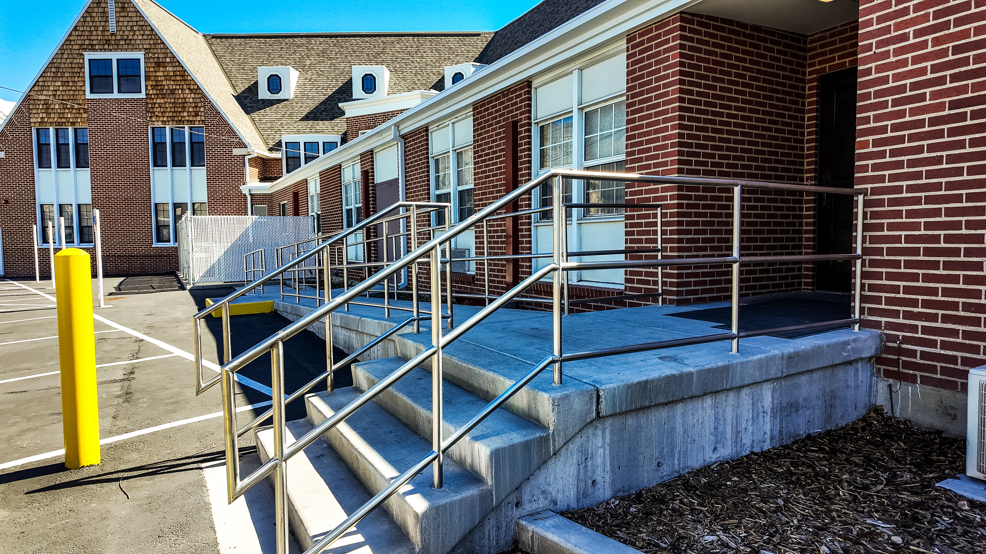 Finished commercial railing installation showing quality steel fabrication and precise field fit.